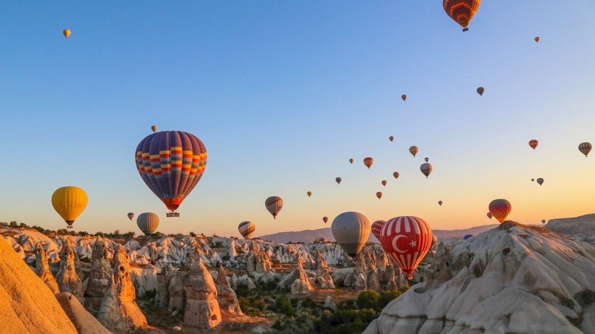 In an undated photo, colorful hot air balloons soar over Cappadocia, Nevşehir, central Türkiye. (Shutterstock Photo)