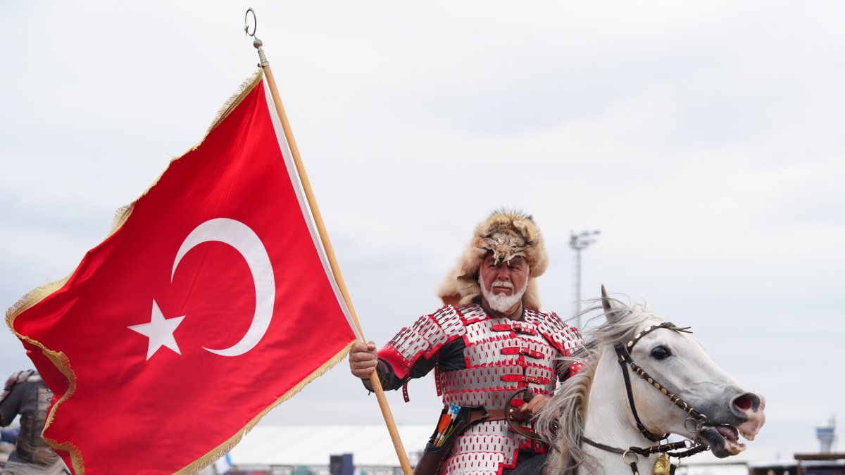 A traditional horseback rider waves the Turkish flag during the first day of the 8th Ethnosport Culture Festival, Istanbul, Türkiye, May 21, 2026. (AA Photo)