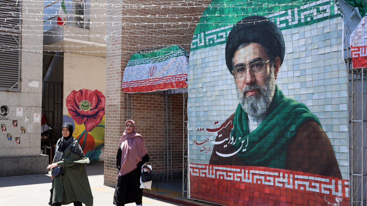 Iranians walk past a picture of Iranian Supreme Leader Ayatollah Mojtaba Khamenei in Tehran, Iran, May 18, 2026. (EPA Photo)