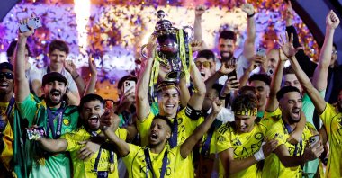 Al-Nassr's Cristiano Ronaldo and team members celebrate with the trophy after winning the Saudi Pro League, Riyadh, Saudi Arabia, May 21, 2026. (Reuters Photo)