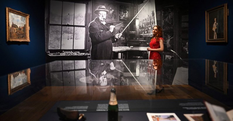 A gallery assistant poses for a photograph at the "Winston Churchill: The Painter" exhibition at the Wallace Collection in central London, U.K., May 20, 2026. (AFP Photo)
