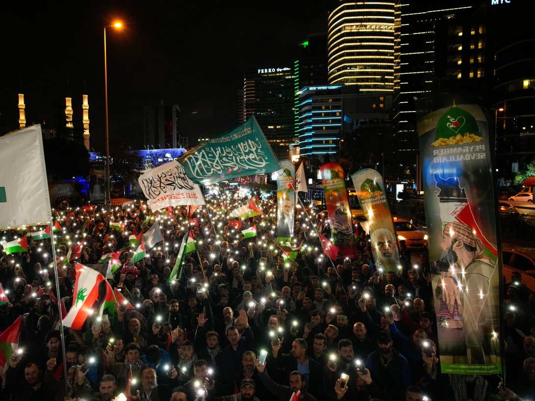 People gather in front of the Israeli Consulate during a protest against the interception of the Gaza-bound Sumud flotilla by Israeli navy forces, Istanbul, Türkiye, Oct. 2, 2025. (AP Photo)