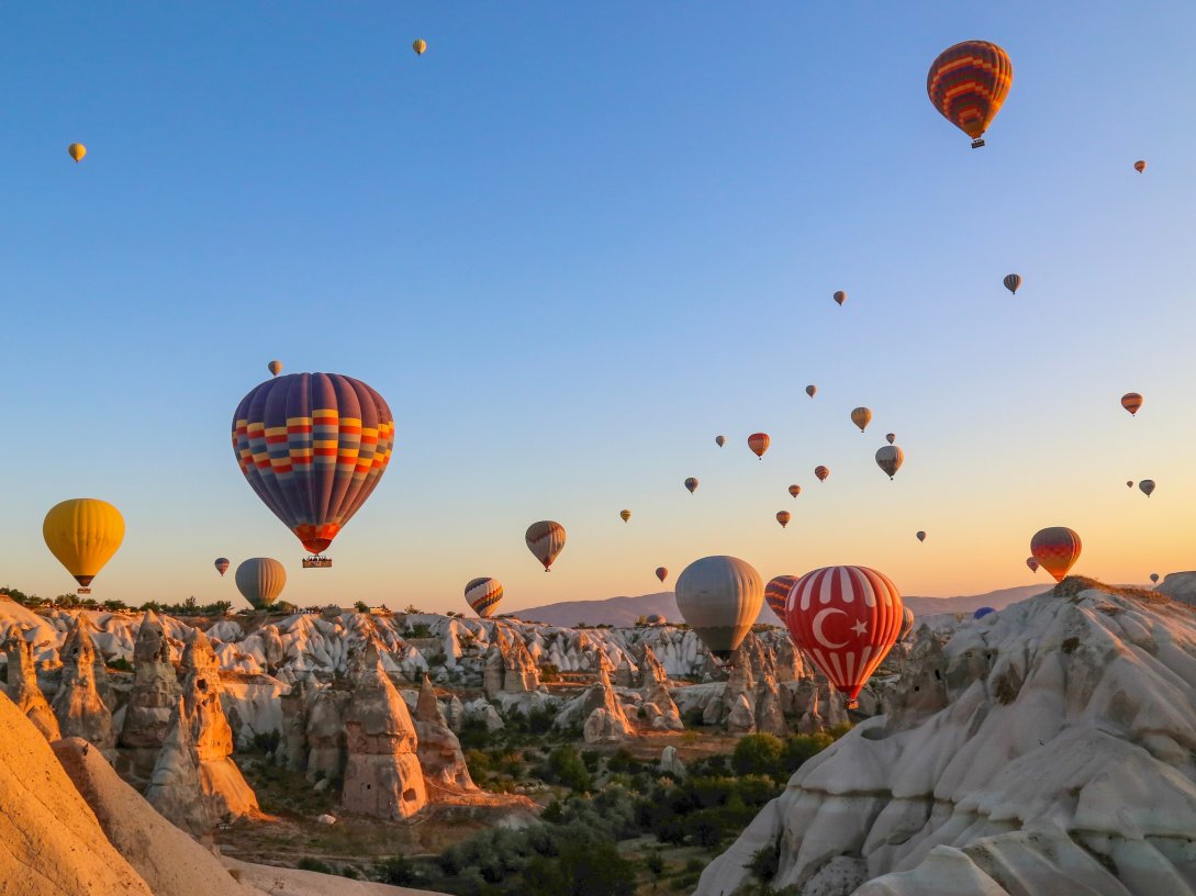 In an undated photo, colorful hot air balloons soar over Cappadocia, Nevşehir, central Türkiye. (Shutterstock Photo)
