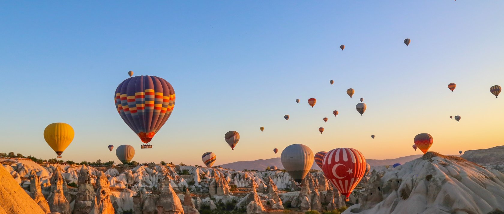 In an undated photo, colorful hot air balloons soar over Cappadocia, Nevşehir, central Türkiye. (Shutterstock Photo)