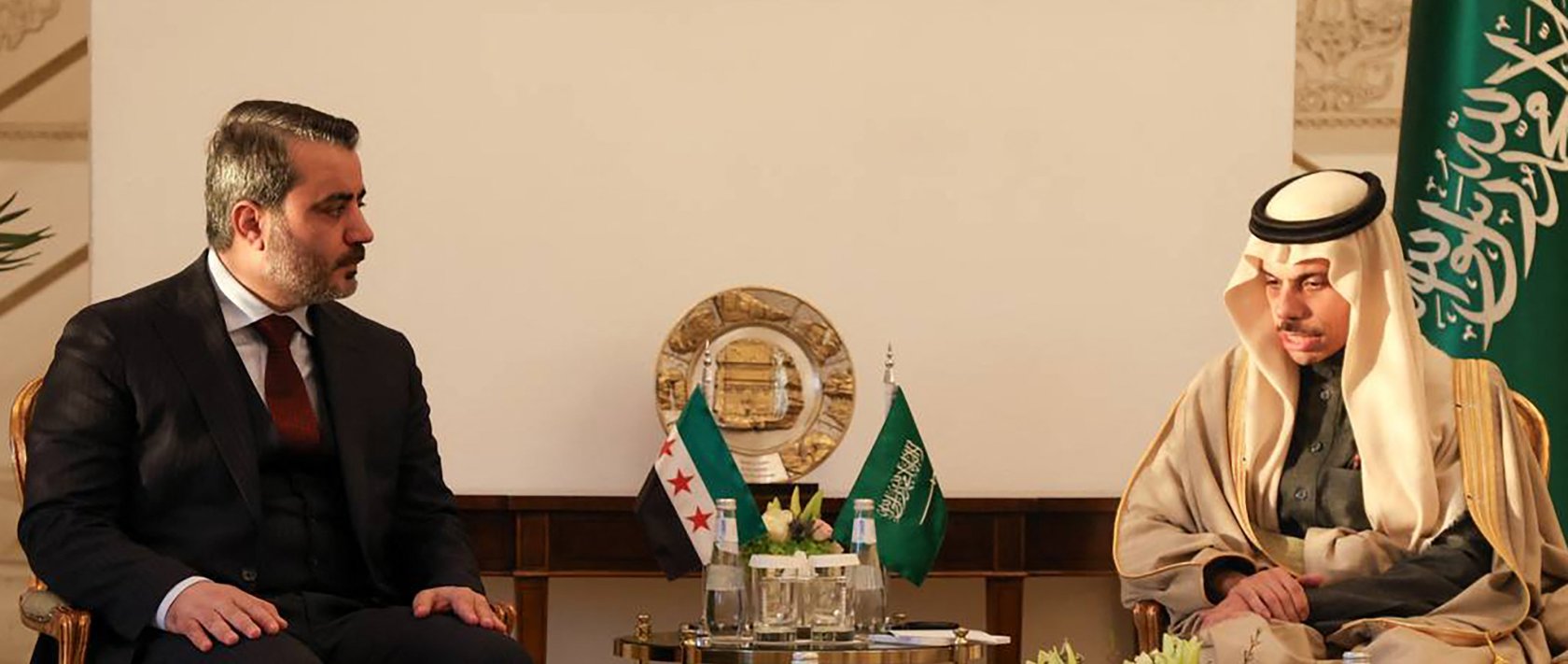 Syria's Foreign Minister Asaad al-Shaibani (L) meeting with his Saudi counterpart Faisal bin Farhan Al-Saud in Riyadh, Jan. 2, 2025. (Photo by SANA via AFP) 