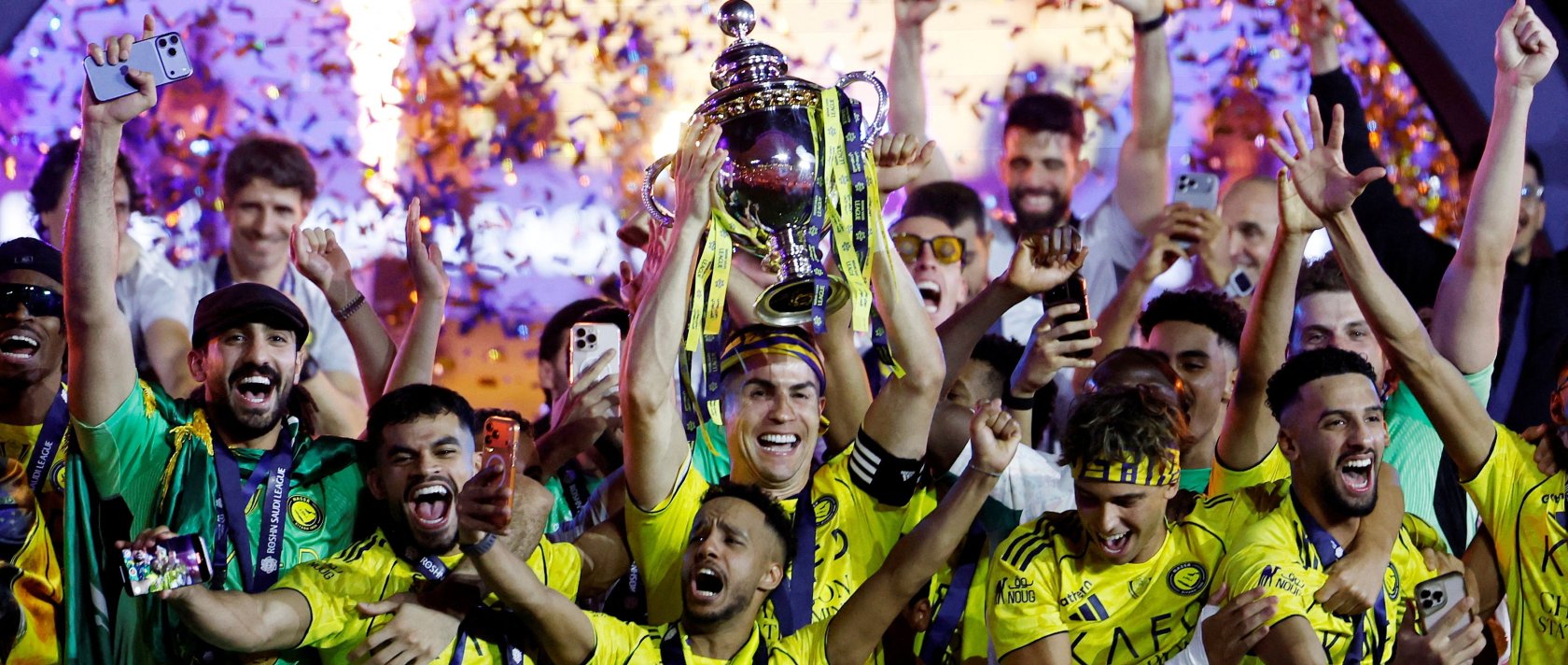 Al-Nassr's Cristiano Ronaldo and team members celebrate with the trophy after winning the Saudi Pro League, Riyadh, Saudi Arabia, May 21, 2026. (Reuters Photo)