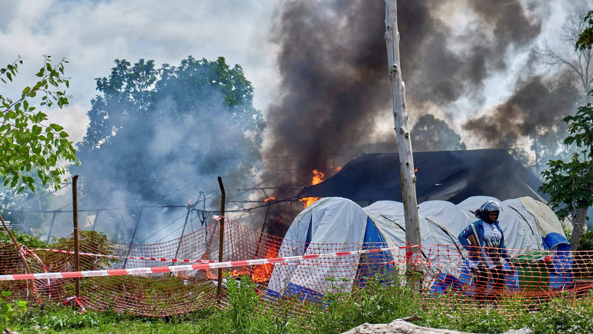 A Congolese police personnel stands guard at the burning Ebola treatment center, as aid agencies intensify efforts to contain a new Ebola outbreak involving the Bundibugyo strain outbreak, in Rwampara general hospital in Rwampara outside Bunia, Ituri province, DRC, May 21, 2026. (Reuters Photo)