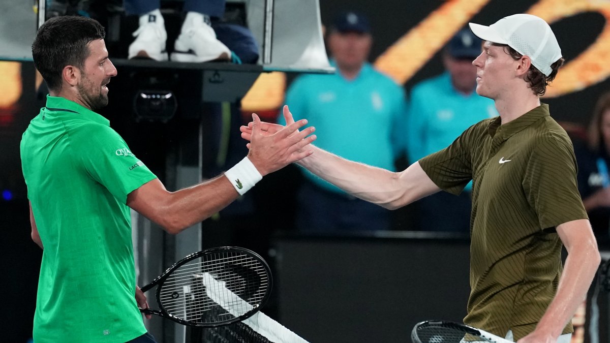 Novak Djokovic (L) is congratulated by Jannik Sinner following their semifinal match at the Australian Open tennis championship, Melbourne, Australia, Jan. 31, 2026. (AP Photo)