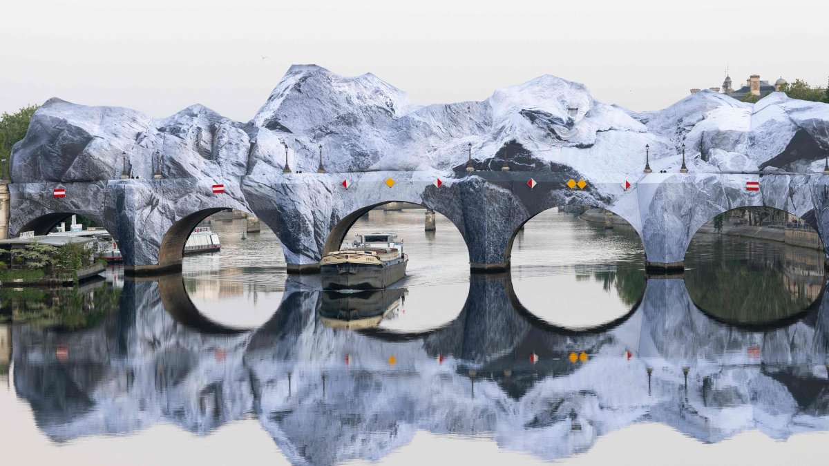 This photograph taken at the Pont-Neuf bridge shows the installation of "The Pont Neuf's cave," the newest artwork by French photographer and street artist JR, Paris, France, May 22, 2026. (AFP Photo)