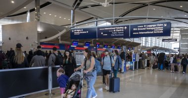 People walk through the Edward H. McNamara Terminal at Detroit Metropolitan Airport, Detroit, U.S., May 21, 2026. (AFP Photo)