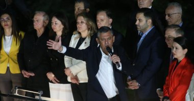 Suspended Republican People's Party (CHP) Chair Özgür Özel (C) addresses supporters outside the CHP headquarters from atop a bus, Ankara, Türkiye, May 21, 2026. (EPA Photo)