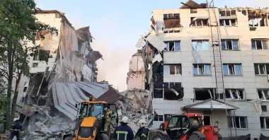 Rescuers work at the scene near a destroyed dormitory building of the Starobilsk College of Luhansk Pedagogical University following an overnight attack, what Russian-installed authorities called a Ukrainian drone strike, in the course of the Russia-Ukraine conflict in the town of Starobilsk (Starobelsk), Luhansk region, Ukraine, May 22, 2026. (Reuters Photo)