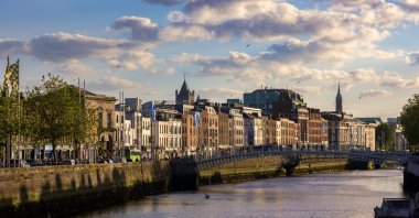 Pedestrians cross the Ha'penny Bridge over the River Liffey, Dublin, Ireland, June 8, 2024. (Shutterstock Photo)