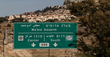 A road sign stands in front of the Israeli settlement of Maale Adumim, on the outskirts of Jerusalem in the Israeli-occupied West Bank, May 15, 2026. (AFP Photo)