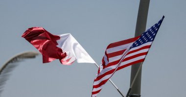 U.S. and Qatar flags are seen on a lamppost ahead of the arrival of U.S. President Donald Trump in Doha, Qatar, May 13, 2025. (Reuters File Photo)