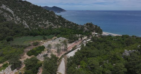 An aerial view of the ancient city of Olympos, where forested landscapes and ruins open onto a Mediterranean beach in the Kumluca district of Antalya, southern Türkiye, May 19, 2026. (AA Photo)