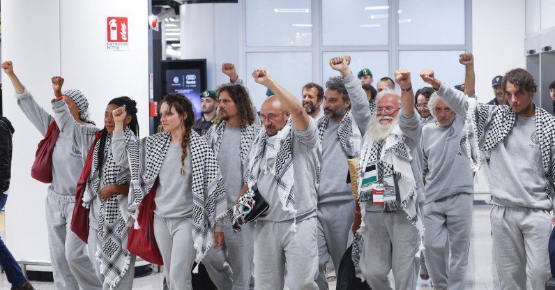 Italian activists from the Gaza-bound Global Sumud Flotilla, detained by Israeli forces after their vessels were intercepted in international waters in the Mediterranean, gesture upon arrival at Fiumicino Airport, Fiumicino, Italy, May 21, 2026. (AA Photo)
