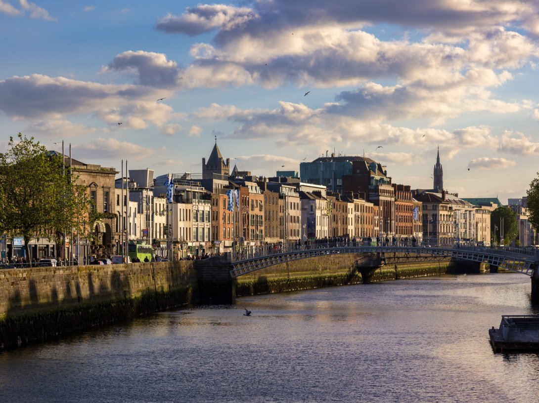 Pedestrians cross the Ha'penny Bridge over the River Liffey, Dublin, Ireland, June 8, 2024. (Shutterstock Photo)