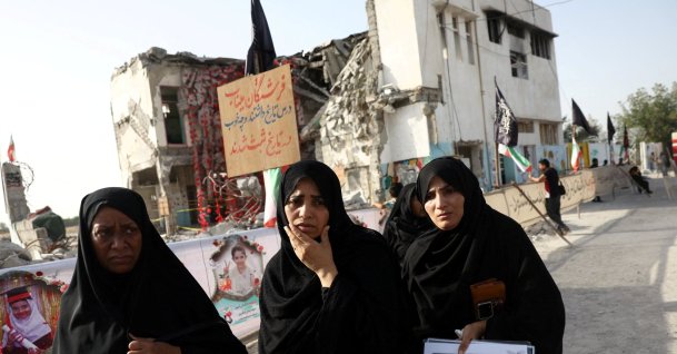 Raheleh, an Iranian woman who lost two of her children in Minab school strike during U.S.-Israeli bombing on Feb. 28, reacts at Minab school in Minab, Iran, May 21, 2026. (Reuters Photo)