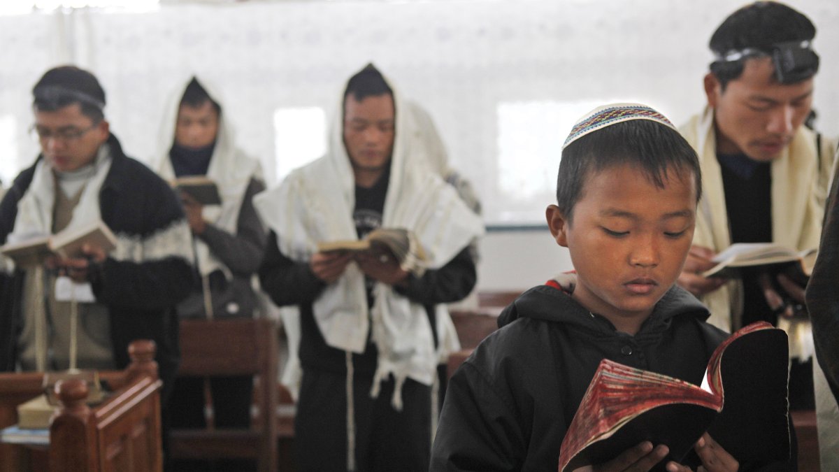 Bnei Menashe Jewish community people pray in a synagogue, during a prayer ceremony, before they leave for Israel from Churachandpur, northeastern Manipur state, India, Dec. 20, 2012. (AP Photo)