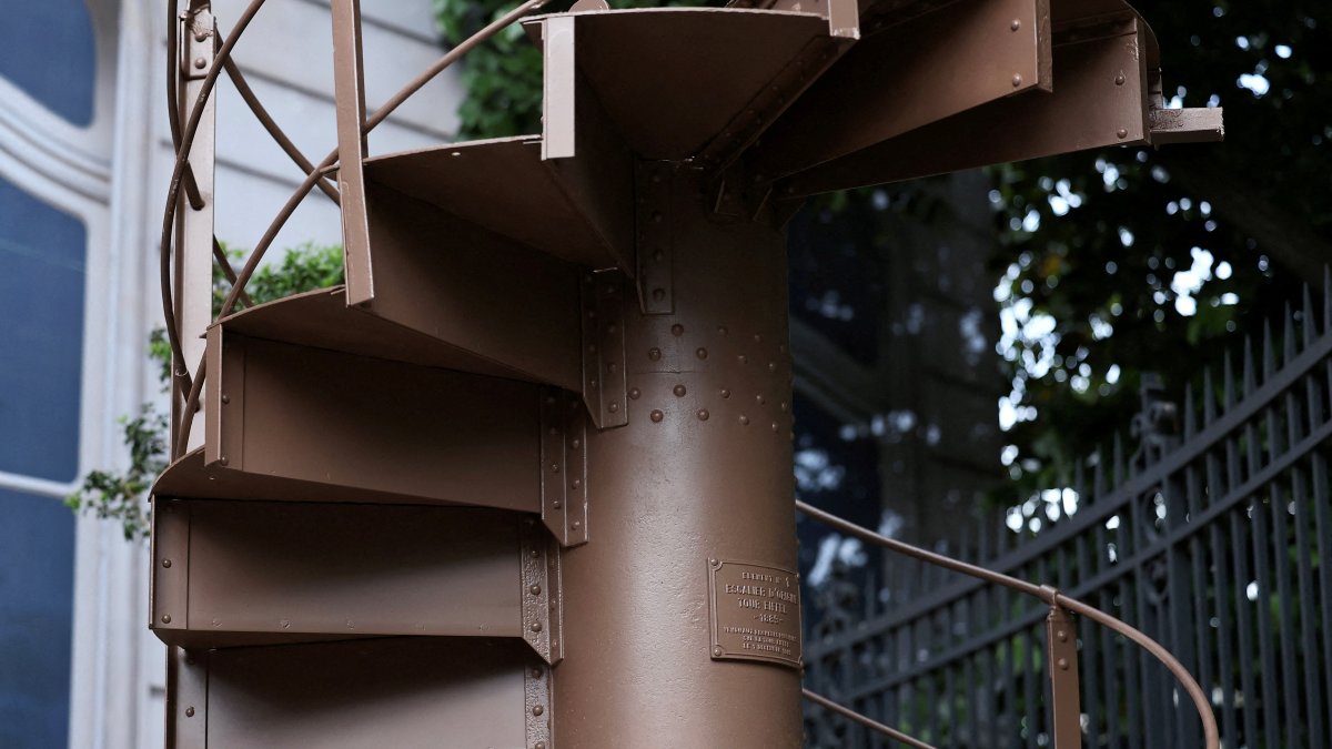 A portion of the original staircase of the Eiffel Tower, built by Gustave Eiffel in 1889, is displayed during a press preview ahead of its upcoming auction organized by Artcurial, Paris, France, May 13, 2026. (Reuters Photo)