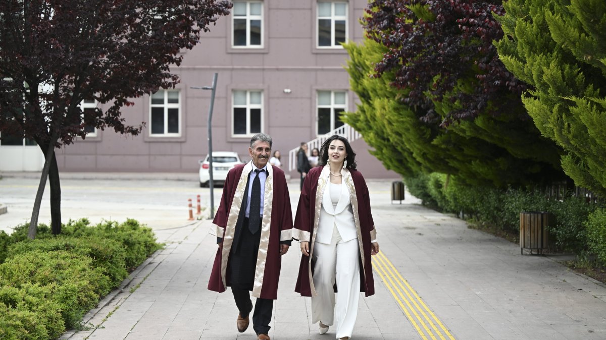 Father and daughter Erdoğan Doğan (L) and Azra Doğan Haçkalı pose in their graduation robes on the campus, Ankara, Türkiye, May 22, 2026. (AA Photo) 