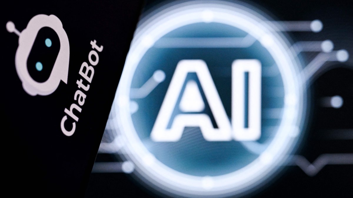 A photo shows the letters AI for Artificial Intelligence on a laptop screen (R) next to the logo of the AI Chatbot application on a smartphone screen in Frankfurt, Germany, May 13, 2026. (AFP Photo)
