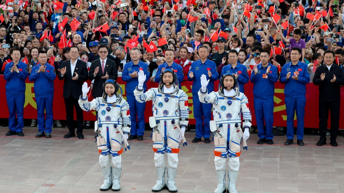 Astronauts Zhu Yangzhu, Zhang Zhiyuan, and Lai Ka-ying, who is the first astronaut from Hong Kong, wave during a see-off ceremony before taking part in the Shenzhou-23 spaceflight mission to China's Tiangong space station, at Jiuquan Satellite Launch Center, near Jiuquan, Gansu province, China, May 24, 2026. (Reuters Photo)