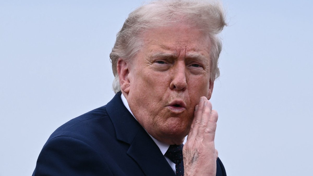 U.S. President Donald Trump gestures as he walks to board a plane at Morristown Airport in Morristown, New Jersey, U.S., May 22, 2026. (AFP Photo)