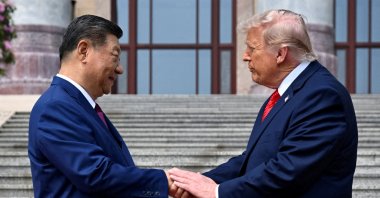 U.S. President Donald Trump (R) greets Chinese President Xi Jinping at the Great Hall of the People, Beijing, China, May 14, 2026. (Reuters Photo)