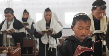 Bnei Menashe Jewish community people pray in a synagogue, during a prayer ceremony, before they leave for Israel from Churachandpur, northeastern Manipur state, India, Dec. 20, 2012. (AP Photo)