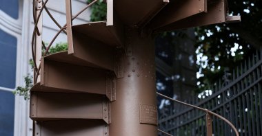 A portion of the original staircase of the Eiffel Tower, built by Gustave Eiffel in 1889, is displayed during a press preview ahead of its upcoming auction organized by Artcurial, Paris, France, May 13, 2026. (Reuters Photo)