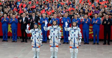 Astronauts Zhu Yangzhu, Zhang Zhiyuan, and Lai Ka-ying, who is the first astronaut from Hong Kong, wave during a see-off ceremony before taking part in the Shenzhou-23 spaceflight mission to China's Tiangong space station, at Jiuquan Satellite Launch Center, near Jiuquan, Gansu province, China, May 24, 2026. (Reuters Photo)