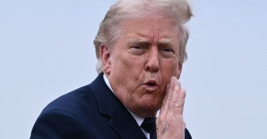U.S. President Donald Trump gestures as he walks to board a plane at Morristown Airport in Morristown, New Jersey, U.S., May 22, 2026. (AFP Photo)