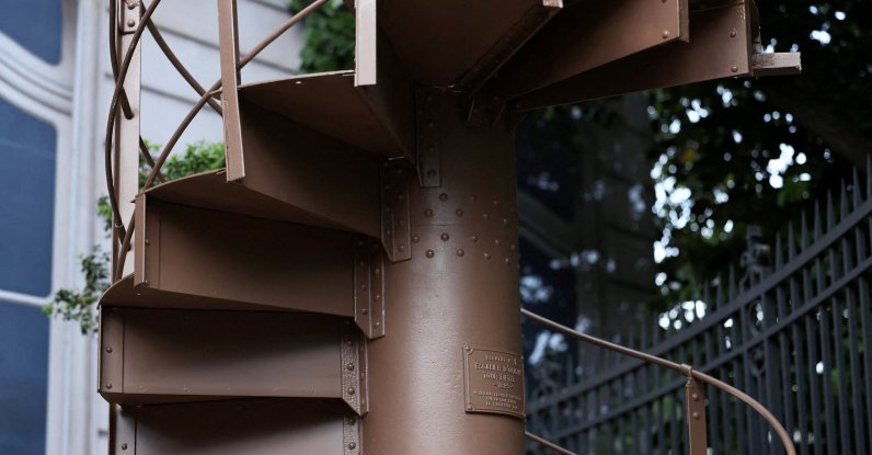 A portion of the original staircase of the Eiffel Tower, built by Gustave Eiffel in 1889, is displayed during a press preview ahead of its upcoming auction organized by Artcurial, Paris, France, May 13, 2026. (Reuters Photo)