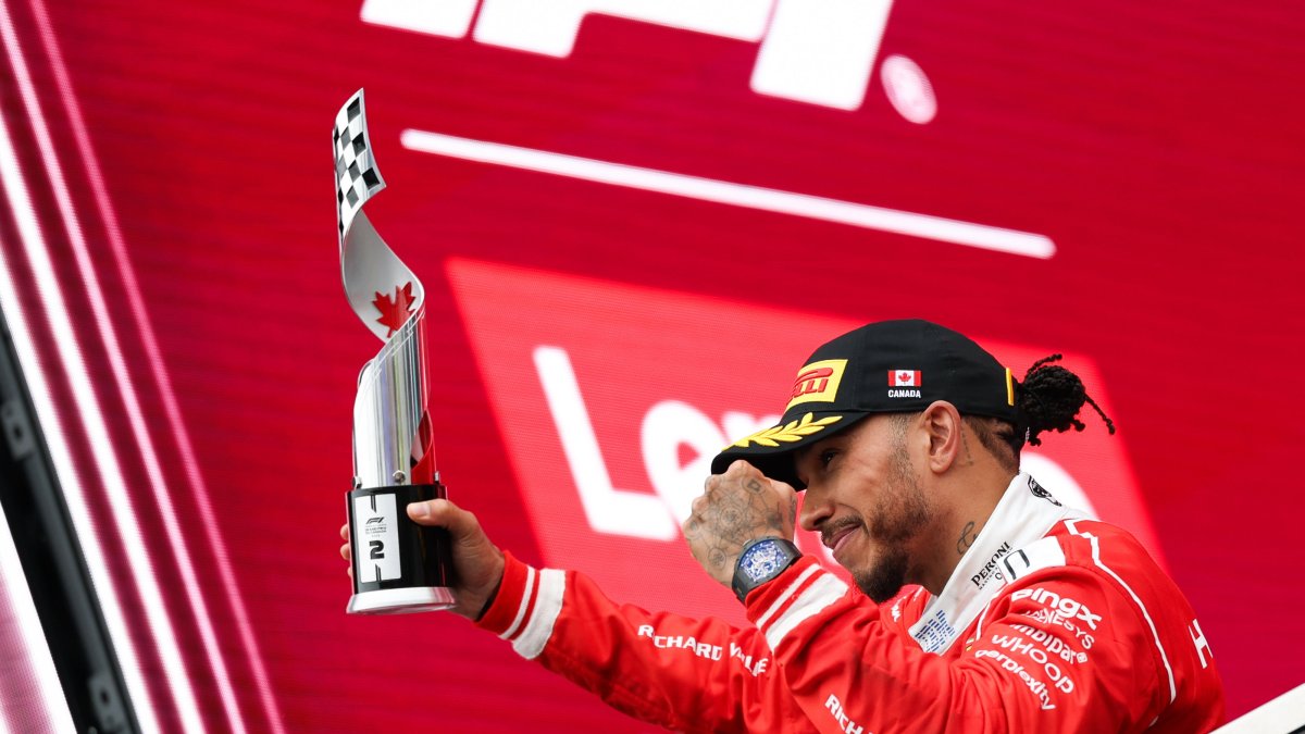 Second-placed Lewis Hamilton of Great Britain and Scuderia Ferrari on the podium with his trophy during the F1 Grand Prix of Canada at Circuit Gilles-Villeneuve, Montreal, Canada, May 24, 2026. (AA Photo)