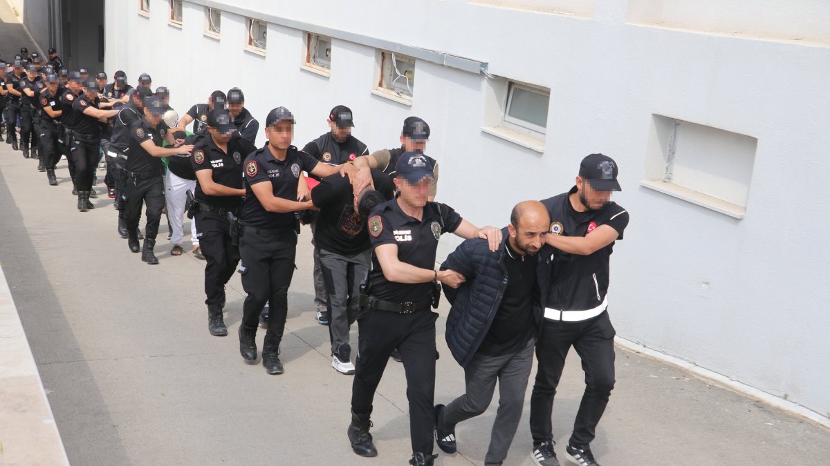 Suspects detained in a drug operation are escorted by security forces in Adana, Türkiye, May 22, 2026. (AA Photo) 
