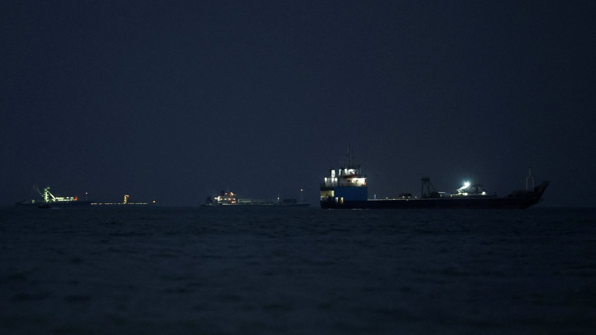 Vessels in the Strait of Hormuz are visible near the beach of Bandar Abbas, Iran, May 22, 2026. (West Asia News Agency via Reuters)