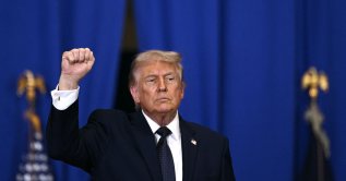 US President Donald Trump raises a fist as he departs after delivering a speech about the economy at Rockland Community College Fieldhouse in Suffern, New York, U.S., May 22, 2026. (AFP Photo)