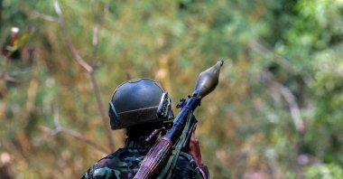 A soldier from the Karen National Liberation Army (KNLA) carries an RPG launcher at a Myanmar military base at Thingyan Nyi Naung village on the outskirts of Myawaddy, the Thailand-Myanmar border town under the control of a coalition of rebel forces led by the Karen National Union, Myanmar, April 15, 2024. (Reuters Photo)
