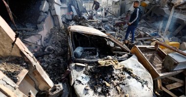 Palestinians inspect the site of an Israeli strike on a house in Deir al-Balah, in the central Gaza Strip, May 24, 2026. (Reuters Photo)