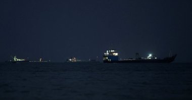 Vessels in the Strait of Hormuz are visible near the beach of Bandar Abbas, Iran, May 22, 2026. (West Asia News Agency via Reuters)