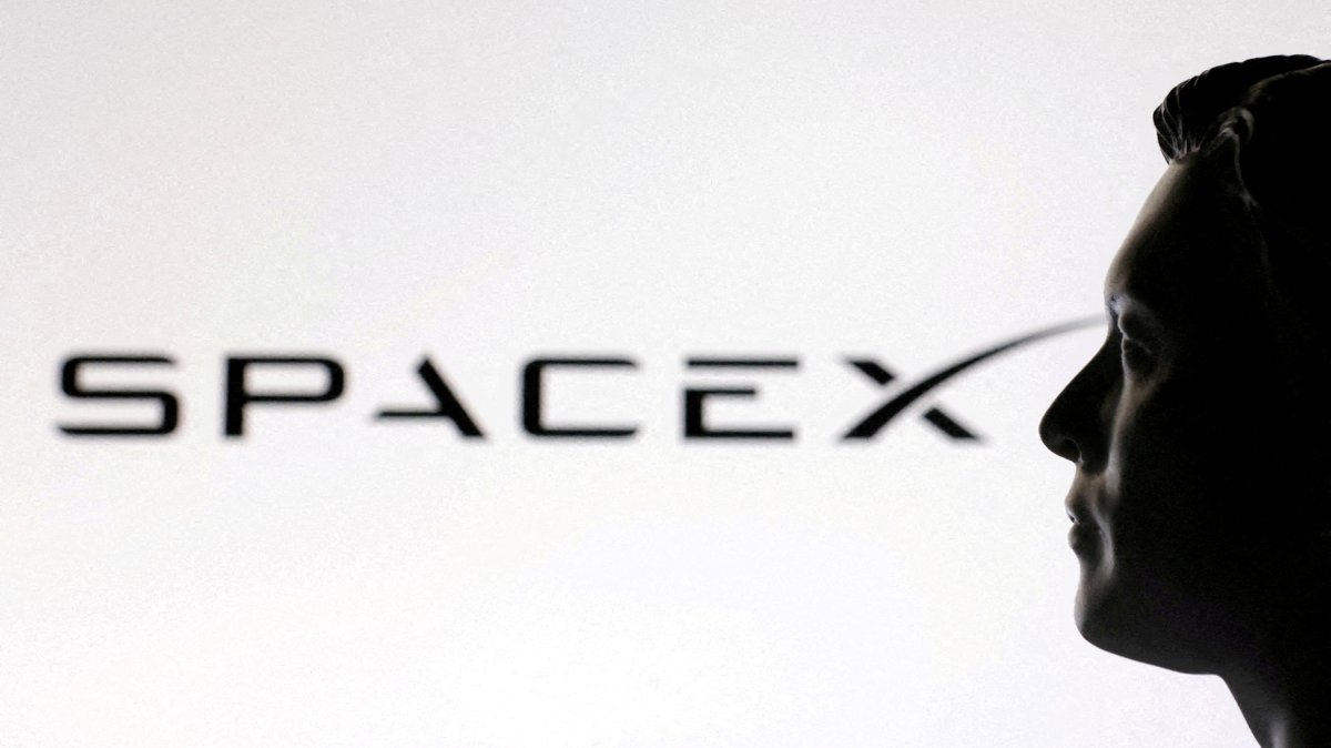 A 3D-printed miniature model of Elon Musk and a SpaceX logo are seen in this illustration created, Jan. 23, 2025. (Reuters Photo)