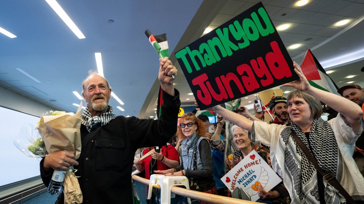 Michael France, a member of the Global Sumud Flotilla to Gaza, reunites with supporters after he arrives at the Vancouver International Airport in Richmond, British Columbia, Canada, May 24, 2026. (AP Photo)