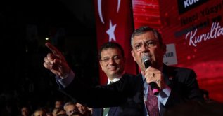 CHP chair Özgür Özel speaks (R) as then-Istanbul Mayor Ekrem Imamoğlu watches him during the party's congress, Ankara, Türkiye, Nov. 5, 2023. (Getty Images Photo)