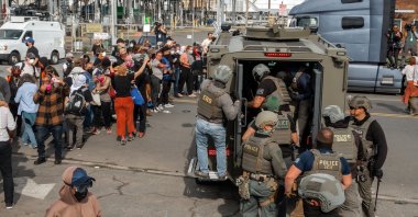Immigration and Customs Enforcement (ICE) officers load into an armored vehicle during a protest against the treatment of detainees, Newark, U.S., May 25, 2026. (EPA Photo)