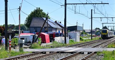 Emergency workers work at the site of an accident after a train crashed into a school bus, at the railway crossing Vierhuizen in Buggenhout, Belgium, May 26, 2026. (AFP Photo)