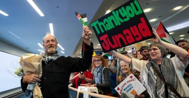 Michael France, a member of the Global Sumud Flotilla to Gaza, reunites with supporters after he arrives at the Vancouver International Airport in Richmond, British Columbia, Canada, May 24, 2026. (AP Photo)