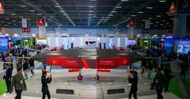 Visitors look at a Bayraktar Kızılelma unmanned fighter jet, developed by defense company Baykar, during the opening day of the SAHA 2026 defense fair, Istanbul, Türkiye, May 5, 2026. (AFP Photo)