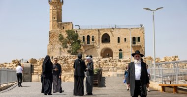 An ultra-Orthodox Jewish man leaves the Tomb of Samuel at the Nabi Samuel village between Ramallah and Jerusalem in the occupied West Bank, Sept. 2, 2022. (AFP File Photo)